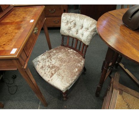 A late 19th Century nursing chair, re-upholstered and on ceramic castors