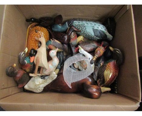 A collection of ceramic, wooden and other ducks