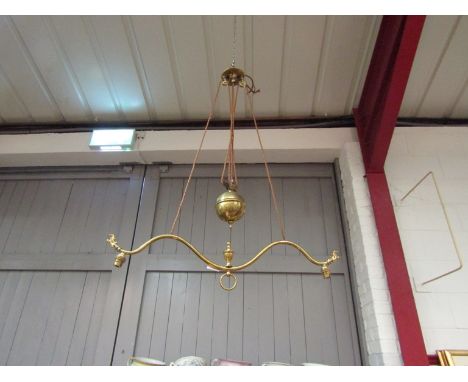 A Victorian brass rise-and-fall ceiling lamp