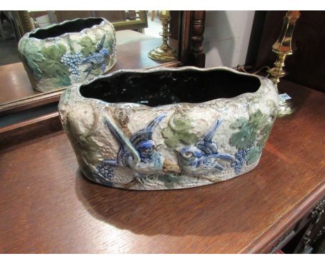 A glazed terracotta planter with blue bird design, 38cm long