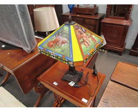 A table lamp with golden retriever design shade