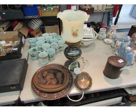 A carved plaque depicting bears, embossed plate, a pair of miniature prints and oil lamp  (5)