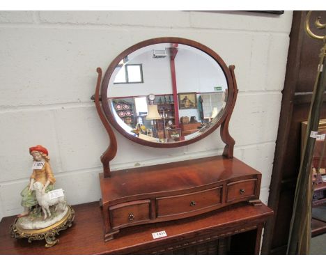A lady's toilet mirror with three jewellery drawer base