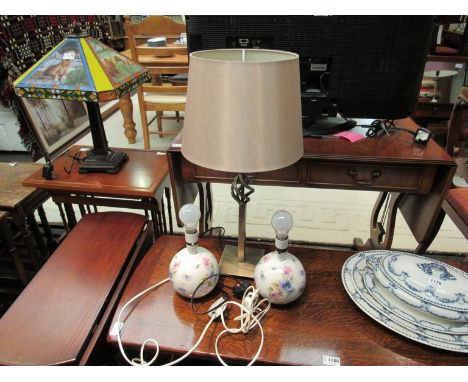 A modern brushed brass table lamp with shade and a pair of ceramic floral lamps  
