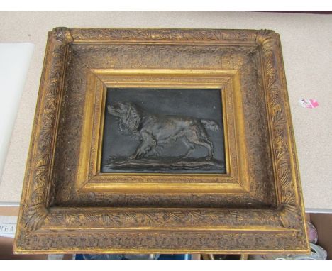 A gesso framed bronze effect high relief plaque depicting gundog, 38cm x 33cm overall