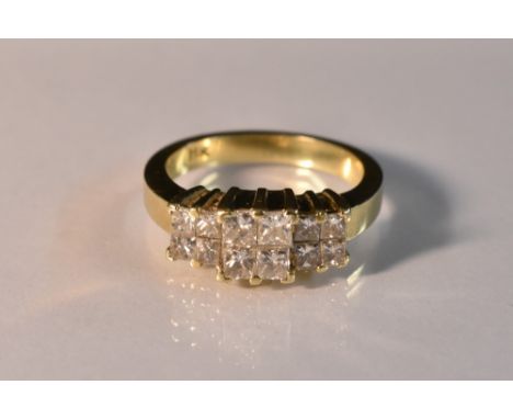 A diamond cluster ring, central quad cluster of square cut diamonds above flankinf conforming smaller quads, total estimated 