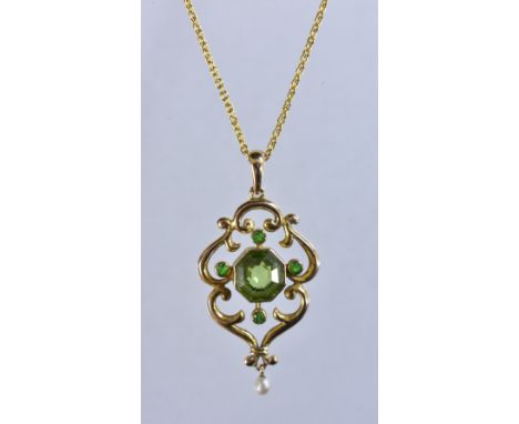 An Art Nouveau peridot and seed pearl pendant necklace,  central octagonal cut green peridot, surrounded by four smaller conf