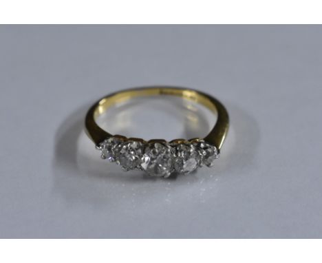 A Diamond five stone line ring, central round brilliant cut diamond approx 0,25ct, flanked by two graduating diamond to each 