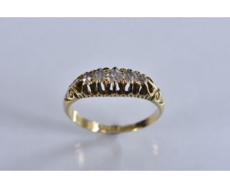 A late Victorian diamond quintet line ring, graduated five stone diamond crest, total estimated diamond weight approx 0.18ct,