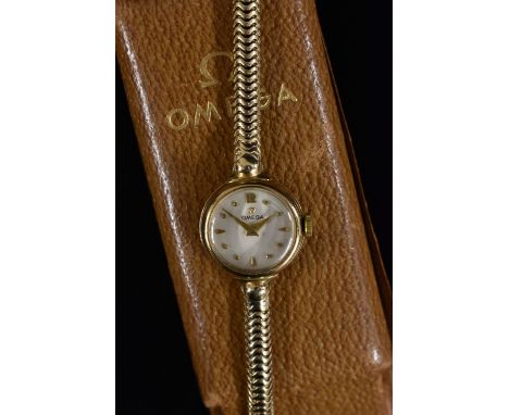 Omega - a lady's 9ct gold bracelet watch, silver dial, Arabic 12, dot and pear drop batons, gilt hands, manual 244 cal moveme