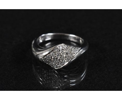 A modernist design diamond cluster ring, arching shaped lobed panel pave encrusted with approx thirty four round cut diamonds