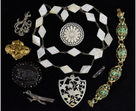 Jewellery - a Victorian pinchbeck brooch; another jet; others-  a Egyptian revival glass and enamel Pharaohs head four panel 