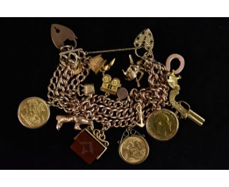 A 9ct gold Albert chain triple row charm bracelet, suspended with 12 assorted charms inc turtle, train etc, two sovereigns 18