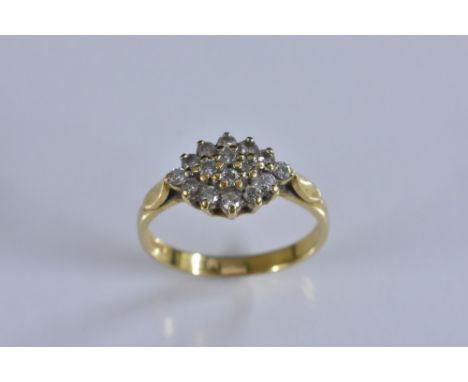 A diamond cluster ring, double layer navette platform inset with sixteen round brilliant cut diamonds, total estimated diamon