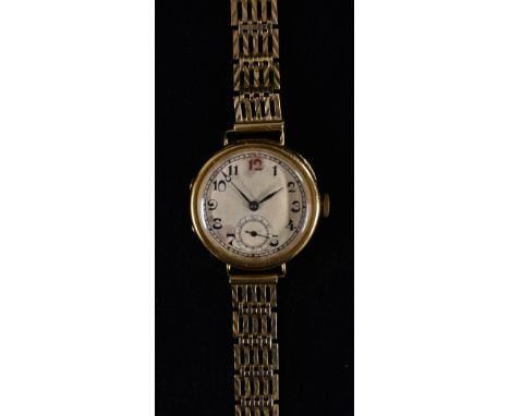 A vintage 18ct gold cased dress watch, textured silvered dial, Arabic numerals, minute track, subsidiary seconds, blued hands