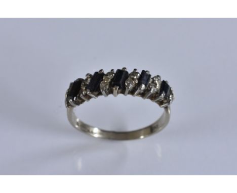 A sapphire and diamond half eternity ring, alternate set with five rectangular cut blue sapphires and pairs of round cut diam