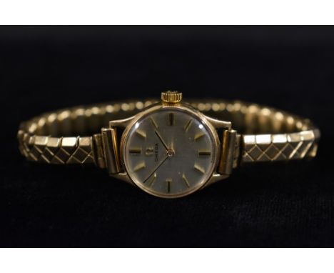 Omega - a vintage 1960s lady's 9ct gold cased wrist watch, silvered dial, block batons, manual wind 245 cal movement, serial 