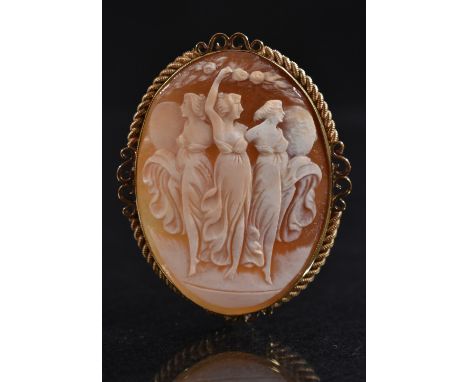 A shell carved cameo brooch, three graces, 9ct gold frame, Birmingham 1953, 10.7g gross