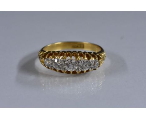 A diamond five stone line ring, graduated round brilliant cut diamond, estimated total diamond weight approx 0.60c, 18ct gold