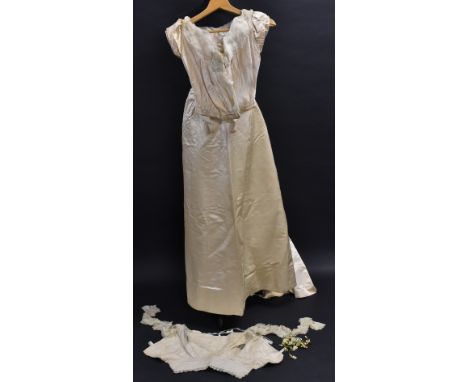 A 19th Century wedding trousseau in cream satin silk with chiffon trim and sleeved underslip with standing collar, a pair of 