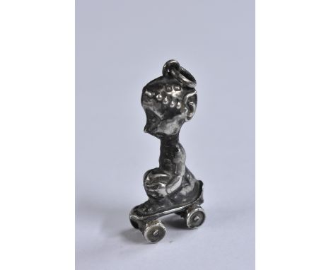 A novelty Edwardian silver Pixie on roller skates charm bracelet fob, Birmingham 1909, 2.2g