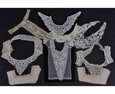 A quantity of lace and other trims to include a Flemish style lace collar, a similar plastron, a black beaded collar, a lace 