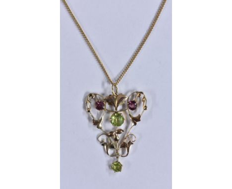 A Edwardian Art Nouveau pink and green paste tourmaline ans peridot effect pendant necklace, stamped 9ct, susp[ended from a 9