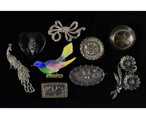 Jewellery  - a 19th century piquet floral panel shield brooch;  a silver aesthetic movement hollow cast panel brooch;  others