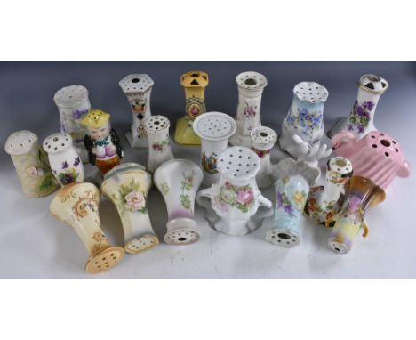 Hatpin stands - a quantity of ceramic stands in a variety of shapes and styles to include violet, rose, forget-me-not and oth