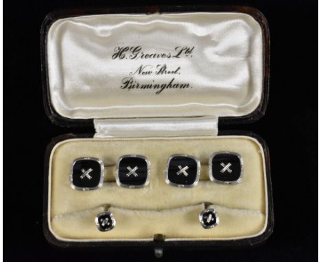An Art Deco rounded square black enamelled cufflinks and collar studs set, stamped 9ct, 7.2g gross, boxed