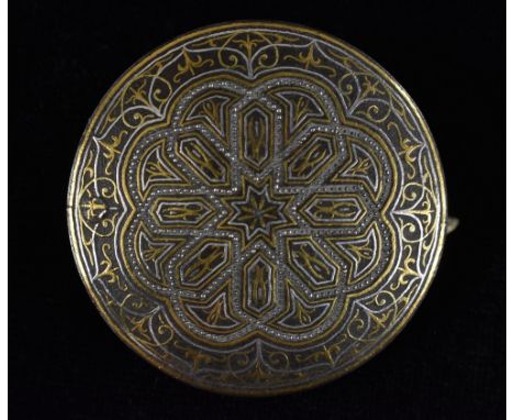 A 19th century Islamic shield brooch, circular base metal body allover inlaid with gold and silver wire, unmarked, 40mm diame