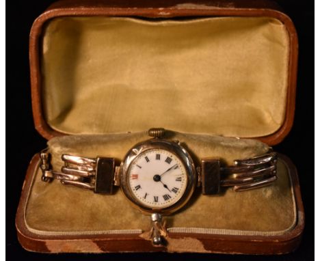 A George V lady's 9ct gold wristwatch, white enamel dial, Roman numerals, manual wind Swiss movement, 9ct gold case and strap