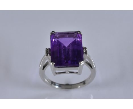 An amethyst solitaire ring, rectangular cushion cut amethyst approx 5.5ct, 18ct white gold shank, London 2011. size K, 4.7g g