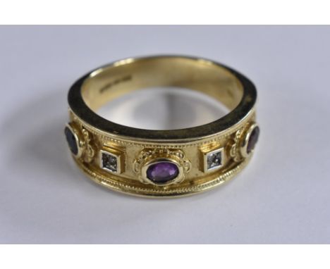 A stylish multi stone tapering band ring, inset with diamonds, amethyst, tourmaline and dark blue spinel stones. 9ct gold sha