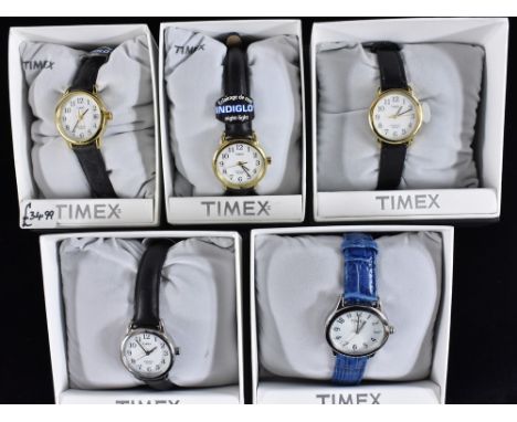 Watches - Timex, a Ladys T2H341 gold coloured dress watch, white dial, Arabic numerals, leather strap;  others T2E221;  T2043