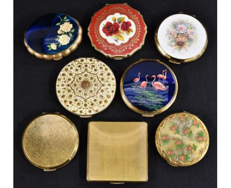 A Kigu of London Concerto musical compact, 1950s, scalloped oval shape, rose design on royal blue ground, bevelled mirror, or