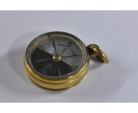 A 19th century yellow metal cased Gingers patent suspension fob compass, mother of pearl and black painted dial, indistinct s