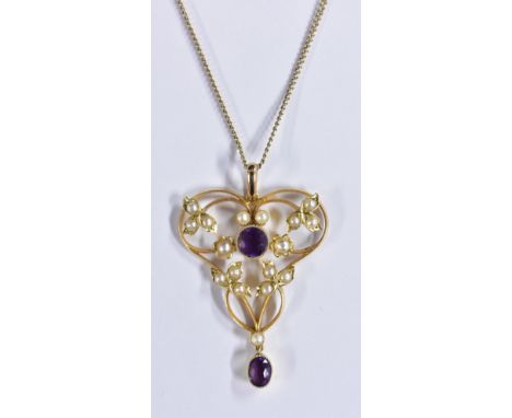 An Art Nouveau seed pearl and amethyst pendant necklace, open heart pendant surmounted with sixteen seed pearls and two oval 