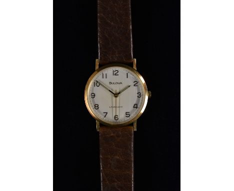 Bulova - a vintage 1970s gentleman's Longchamp 9ct gold wristwatch, silvered dial, raised black Arabic numerals, minute track