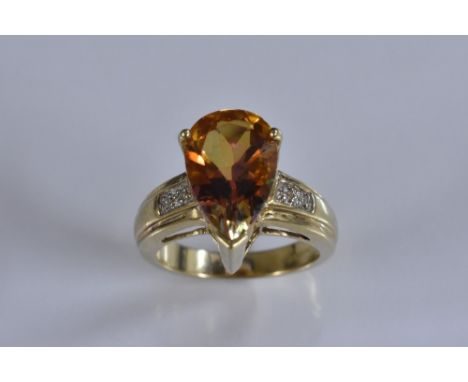 A mystic topaz dress ring, pear drop topaz flashing vibrant pink, orange and purple tone, approx 6.0ct, 9ct gold shank, stamp