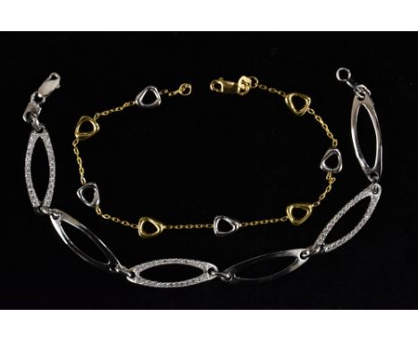 A 9ct yellow and white gold seven panel fine link bracelet, alternating colour rounded triangular panels, fine link dividers,