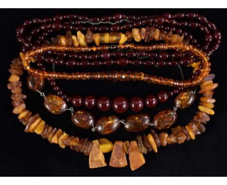 Amber - a quantity of bead necklaces, to include three graduating cherry amber assorted sizes;  a river washed rough bead nec