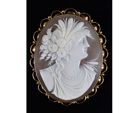 A Victorian/ Edwardian oval shell Cameo brooch, maiden with roses in her hair, bead necklace and flowing dress , 9ct gold fra