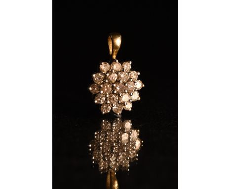 A diamond snowflake pendant, triple layered cluster inset with nineteen round cut diamonds, total estimated diamond weight ap