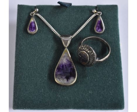 A Blue John fluorite and silver three piece pendant and earring suite, each with a pear drop blue John panel within a sterlin