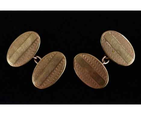 A pair of 9ct gold oval engraved panel cufflinks, Birmingham 1984, 6.6g