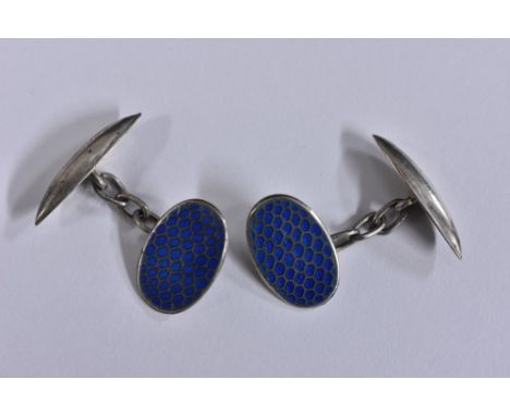 A pair of continental silver and enamel cufflinks, each with an oval blue enamelled scaled platform and torpedo terminals, st