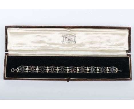 A 9ct white gold and pearl bracelet, 18.5cm, 7.2g, in box