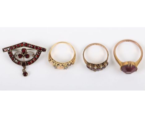 An unmarked 19th century yellow metal ring with four old cut diamonds and two opal cabochons one additional cabochon missing 
