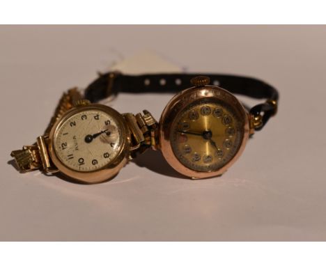 A 9ct gold wrist watch by Avia having an Arabic numeral dial with subsidiary seconds in 9ct gold case on a rolled gold bracel